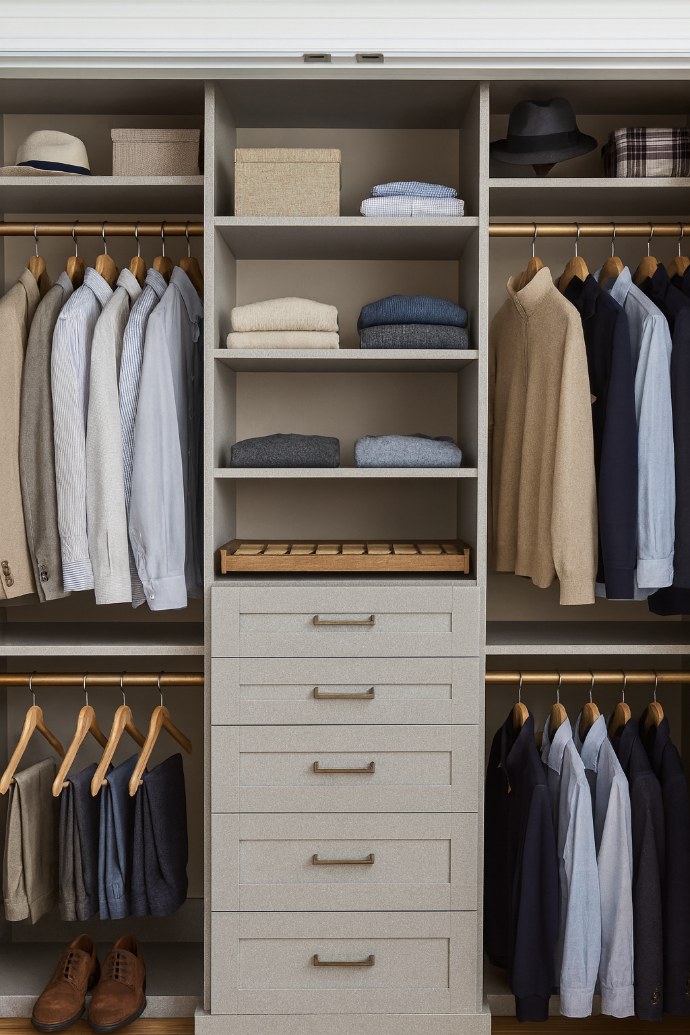 custom reach-in closet with clothing